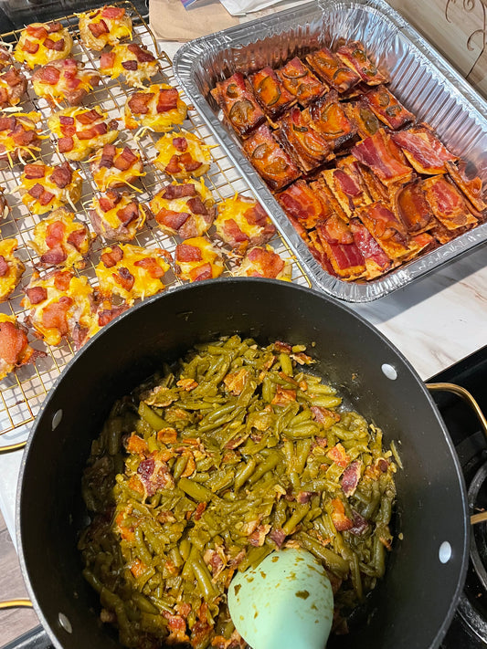 Club crackers topped with caramelized bacon and candied jalapeños on a baking rack