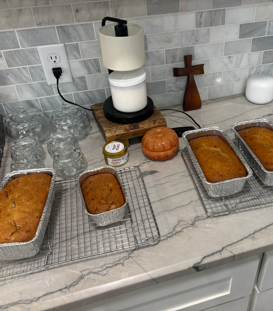 Sour cream banana bread loaf cooling on a rack