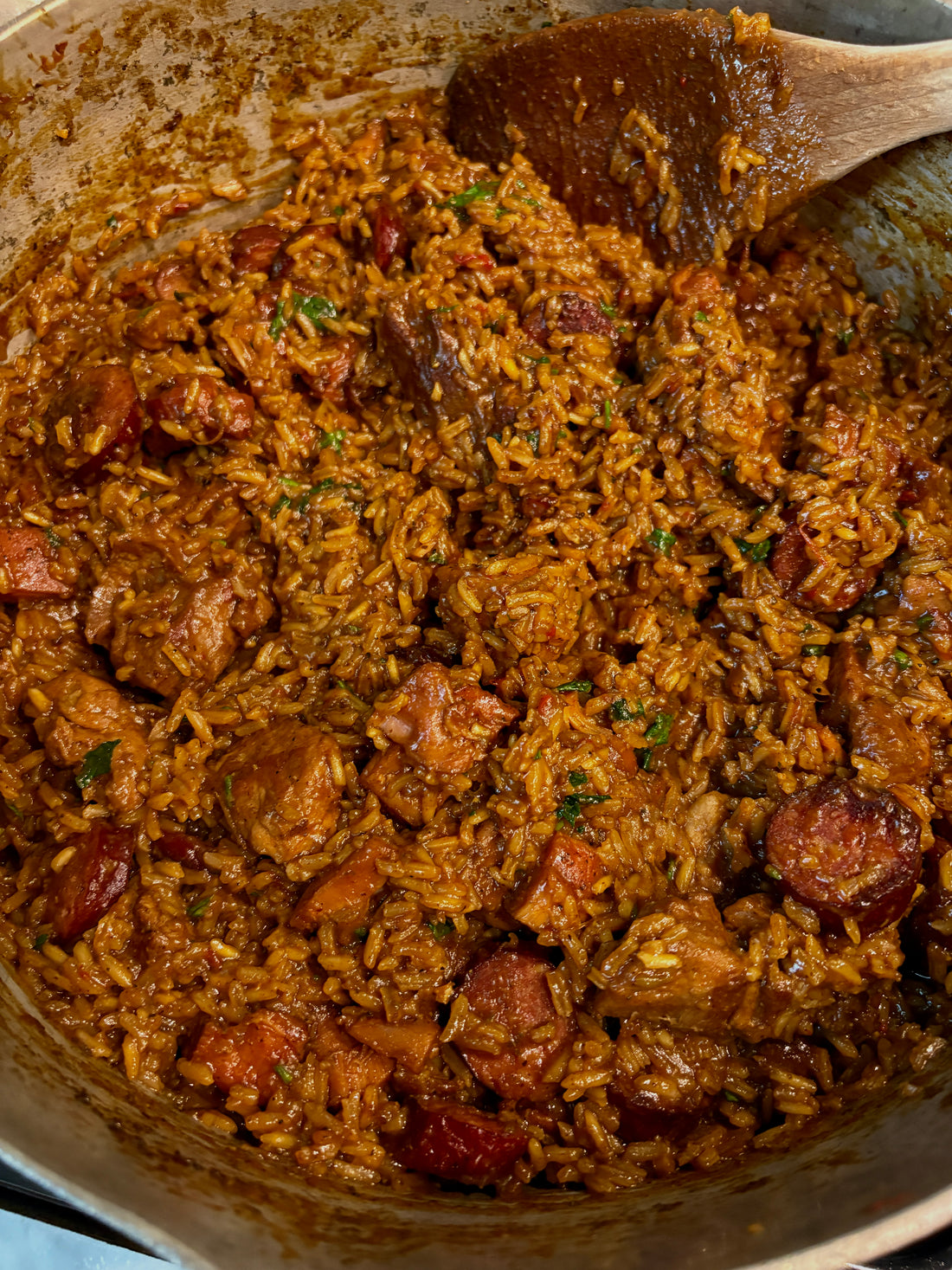 A pot of meaty jambalaya with pork, chicken and smoked sausage