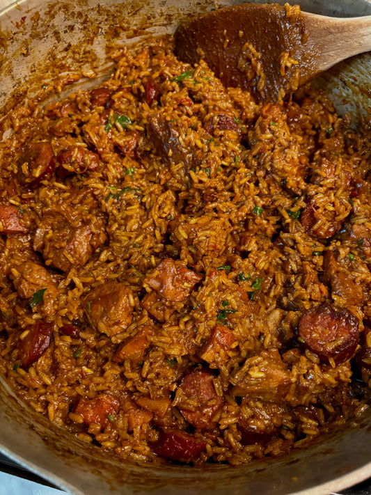 A pot of meaty jambalaya with pork, chicken and smoked sausage