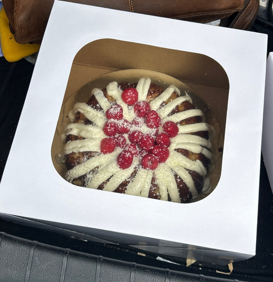 White chocolate raspberry bundt cake with piped cream cheese frosting, member submitted recipe by Christine Duhon, Foodies of Lafayette