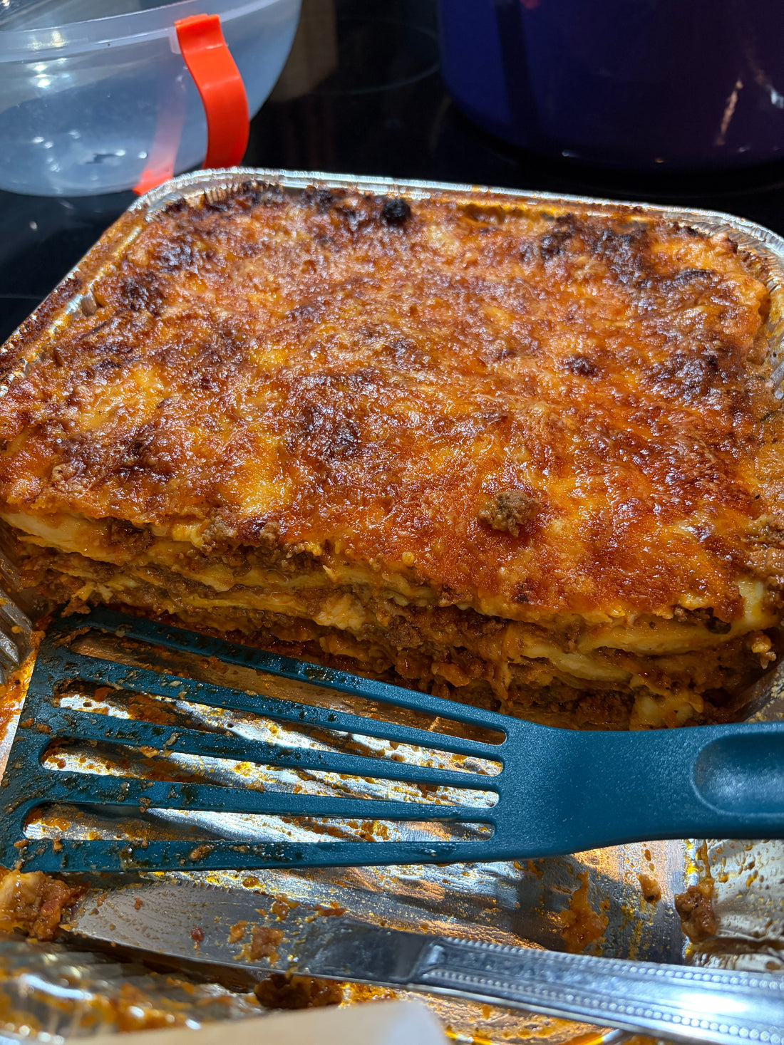 Baked million dollar ravioli with a crusted cheese topping
