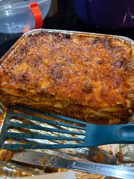 Baked million dollar ravioli with a crusted cheese topping