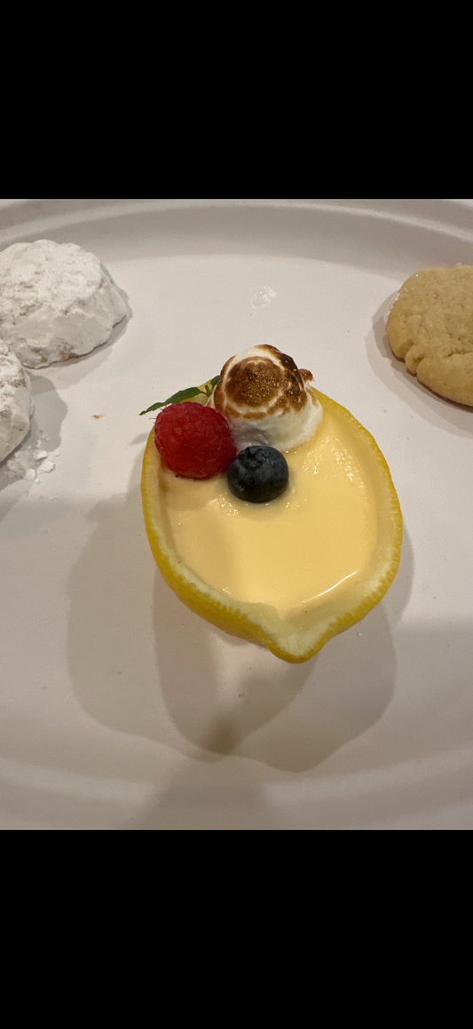 Lemon posset served in hollowed lemon halves, member submitted recipe by Jacob Broussard, Foodies of Lafayette