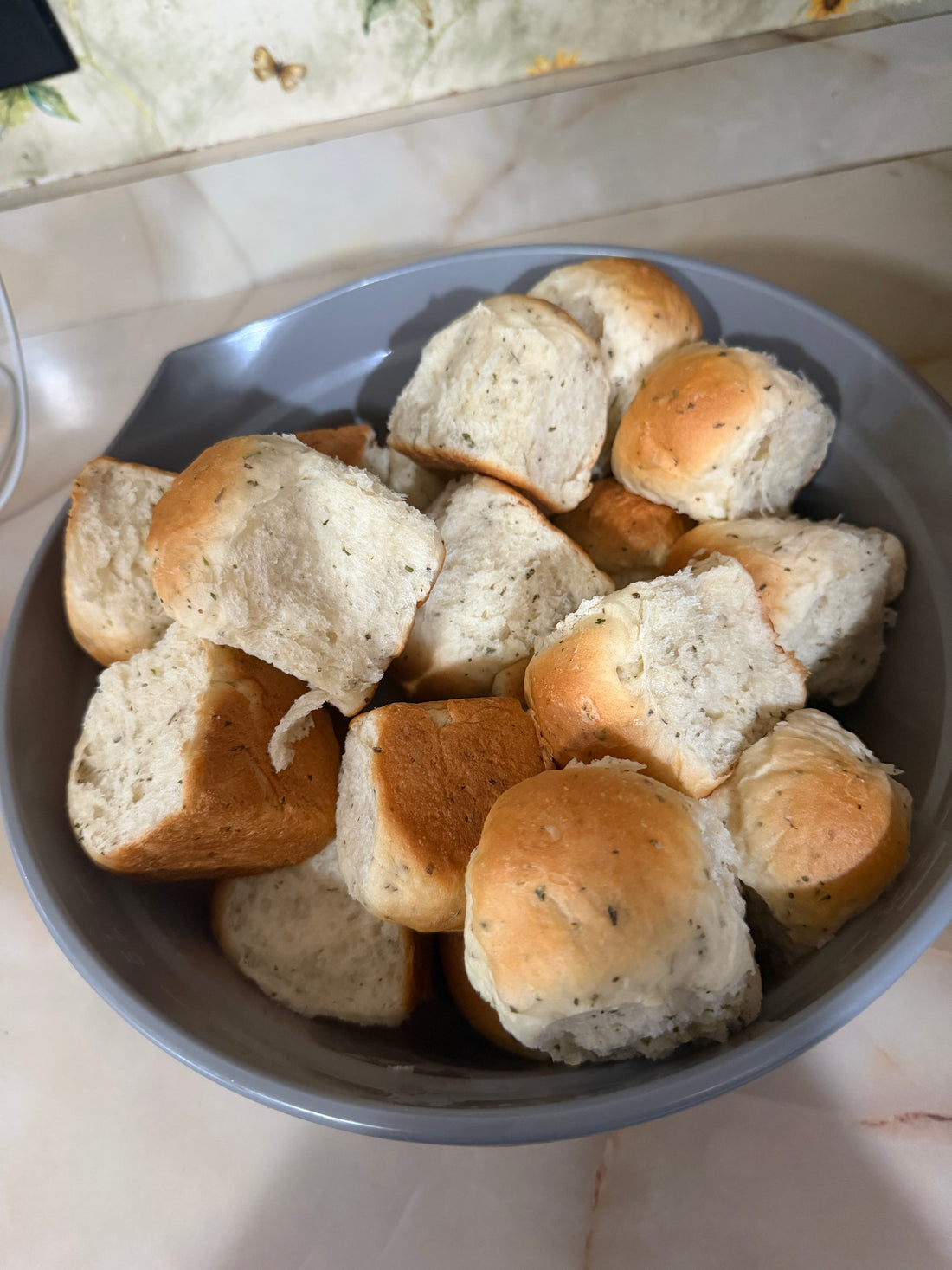 Golden garlic and herb white dinner rolls fresh from the oven