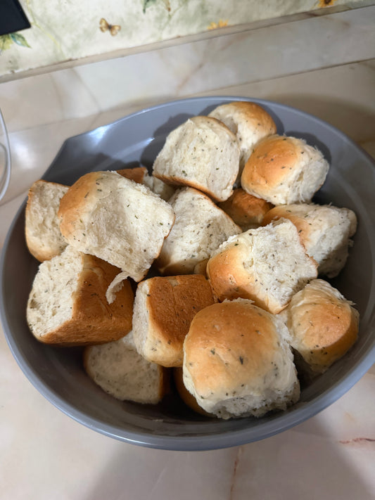 Golden garlic and herb white dinner rolls fresh from the oven
