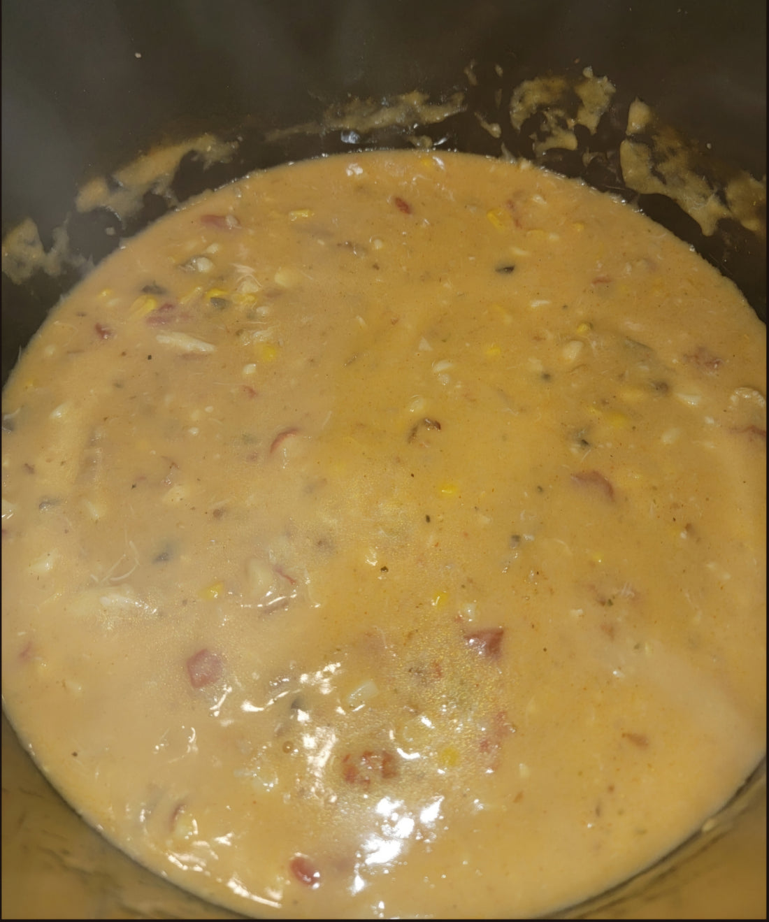 A pot of seafood chowder with shrimp, crawfish and lump crab