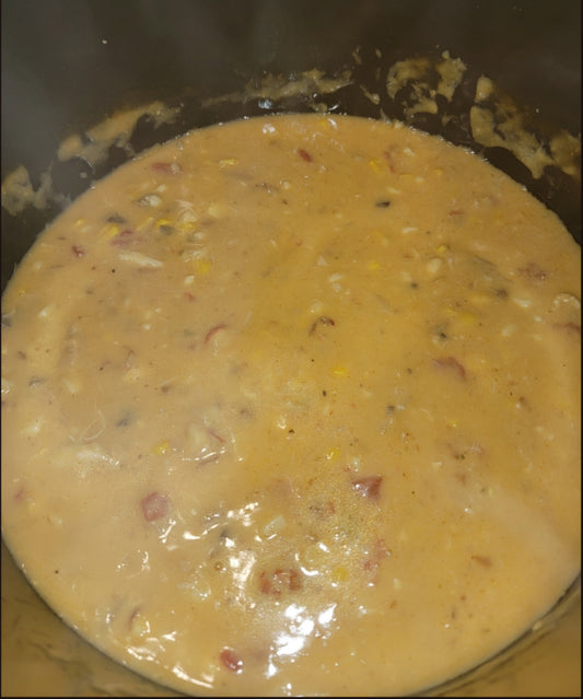A pot of seafood chowder with shrimp, crawfish and lump crab