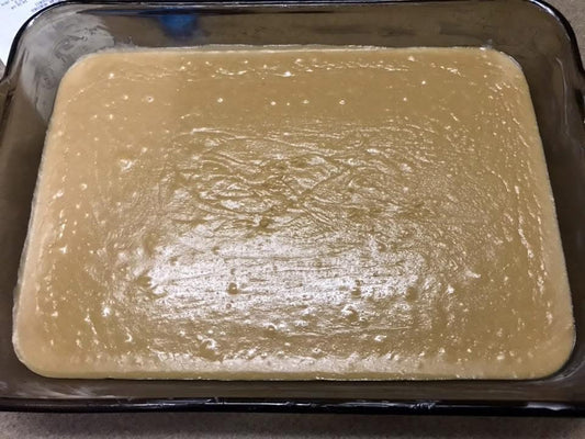Squares of Maw Maw's peanut butter fudge cut and stacked on a plate