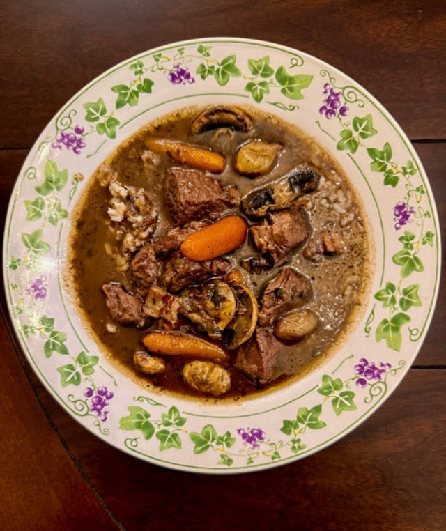 Gumbo oBourguignon, a dark roux beef braise with pearl onions and mushrooms served over Louisiana rice