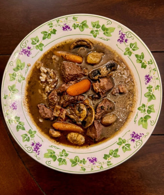 Gumbo oBourguignon, a dark roux beef braise with pearl onions and mushrooms served over Louisiana rice