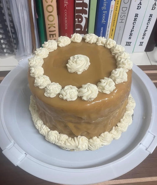 Yellow layer cake covered in cooked caramel icing